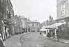 High Street, Horncastle Note the sunblinds and thatched roofs of the shops on the right which were demolished to form the present open space of the Market Place. Photo by Carlton & Sons 