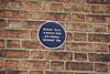 Plaque on the Community centre, marking the site of the Roman wall, 1991. Plaque on the Community centre, marking the site of the Roman wall, 1991.